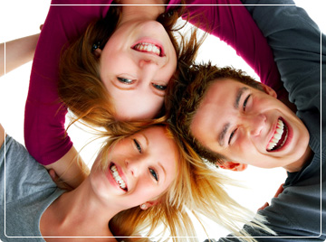 photo of three teens huddled